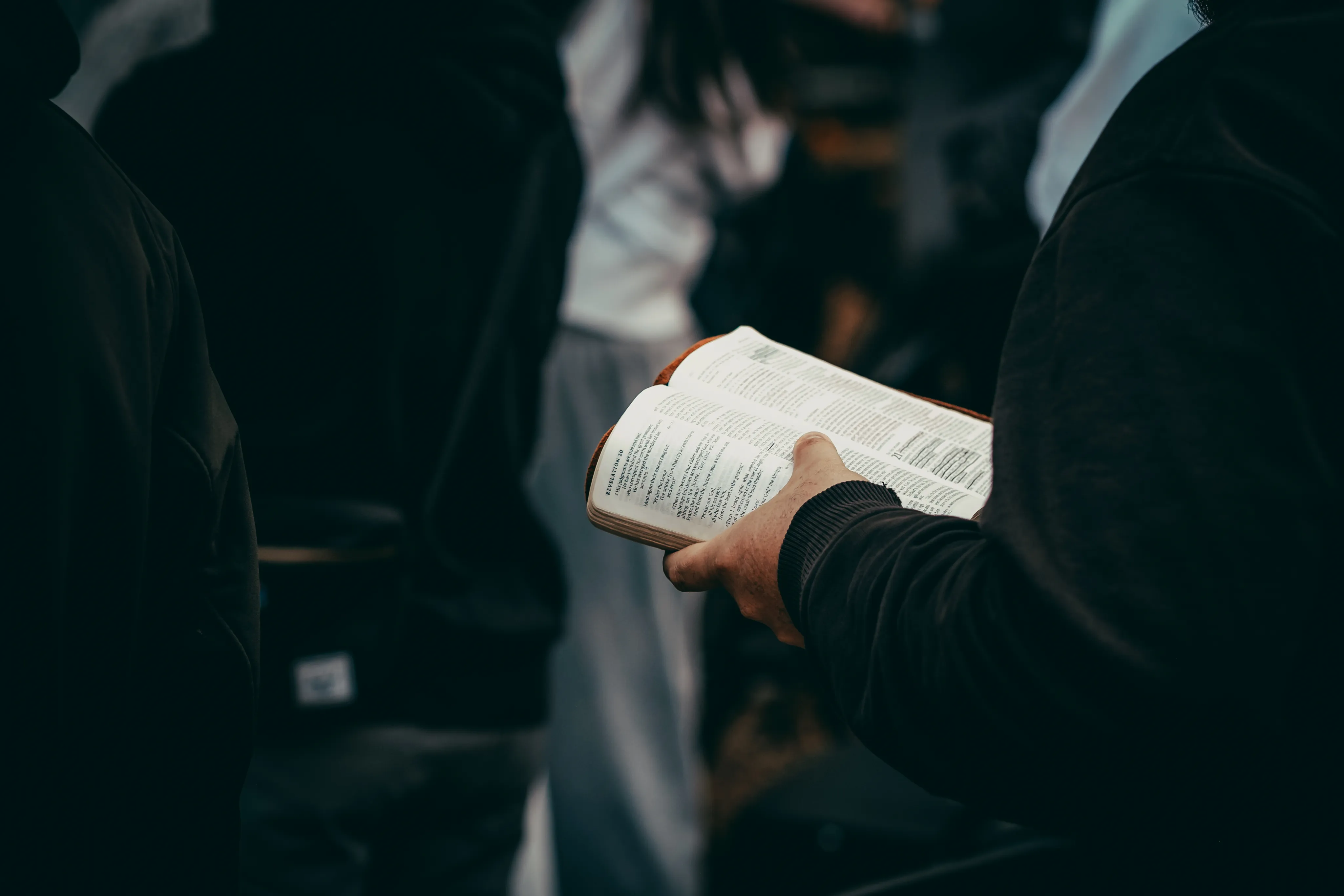 We Are Church members gathered with an open Bible